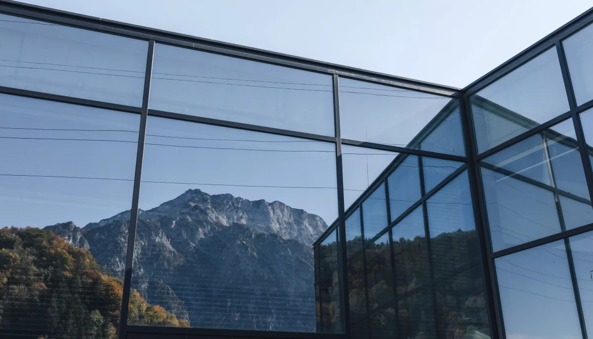 Reflection of Mount Untersberg on windows of KISKA headquarters in Anif-Salzburg
