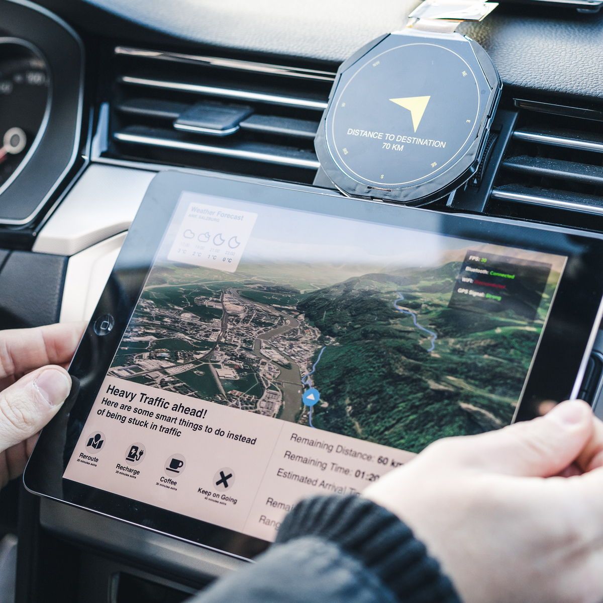 iPad showing navigation route and Prototype compass inside of car