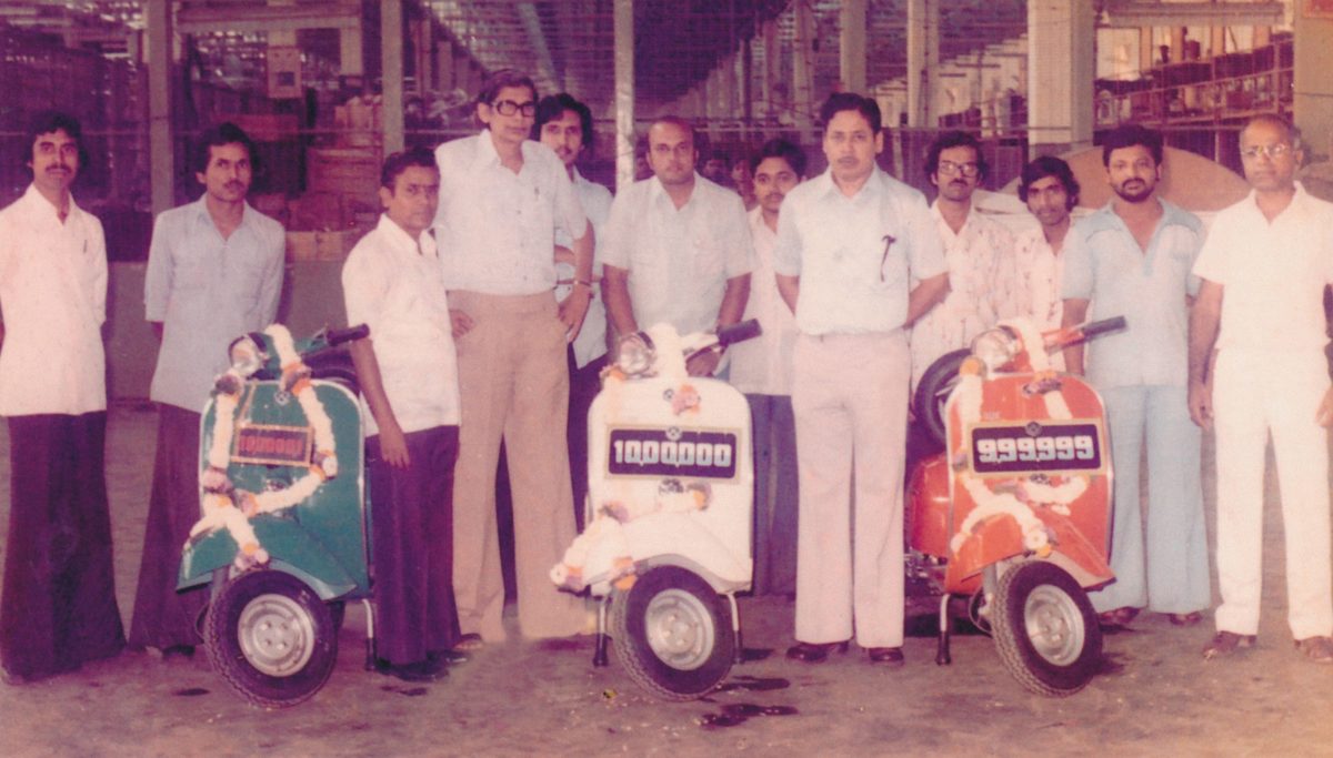 Picture of original Chetak team in India with old retro scooters