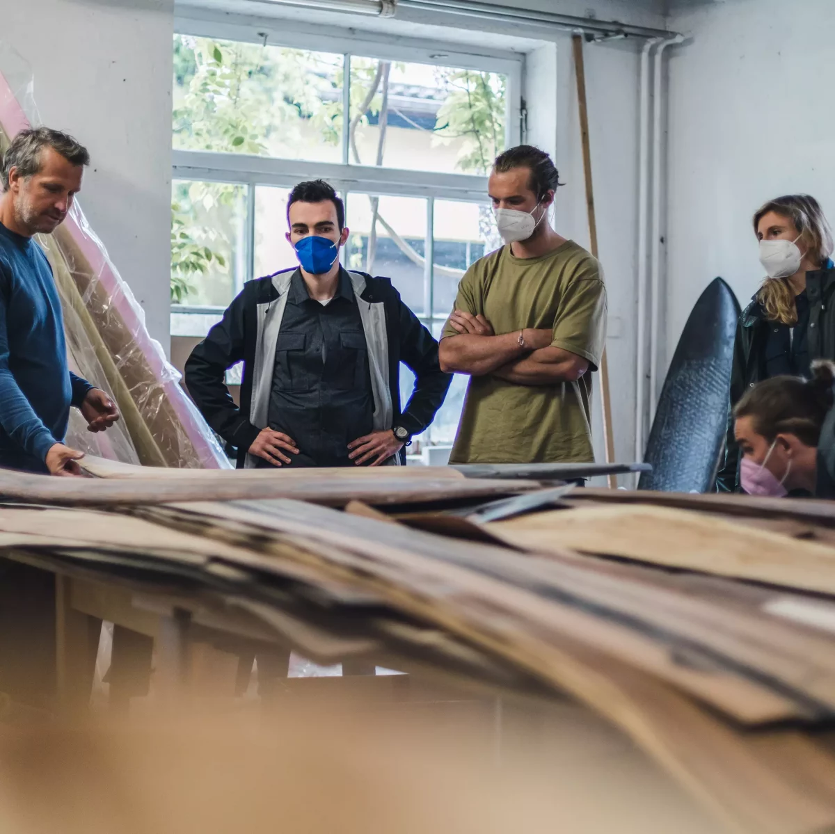 KISKA design team choosing the wood for surf board in square crop