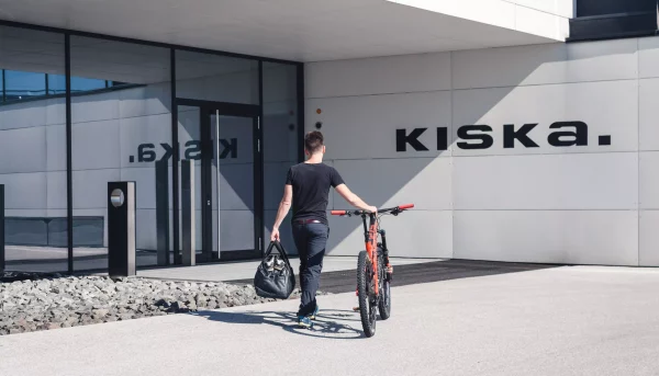 KISKA transportation designer walking bike into KISKA headquarters in Anif-Salzburg, Austria