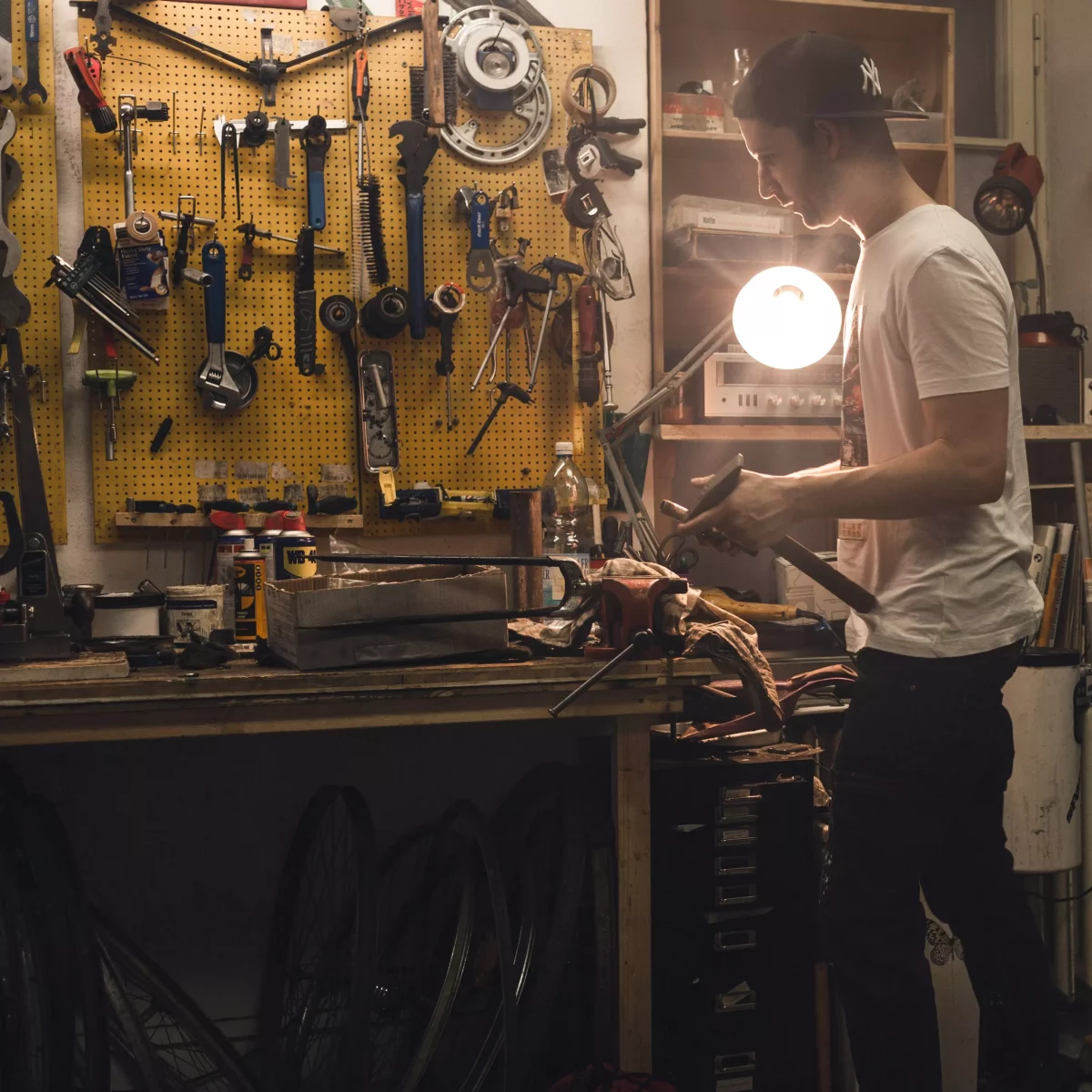 KISKA paint technician repairing a bike after work in Salzburg, Austria