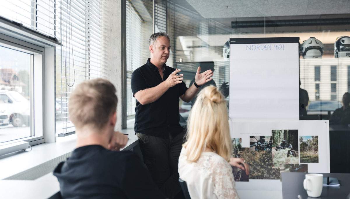 Brand Communication team talk through Husqvarna Norden 901 concepts in meeting room
