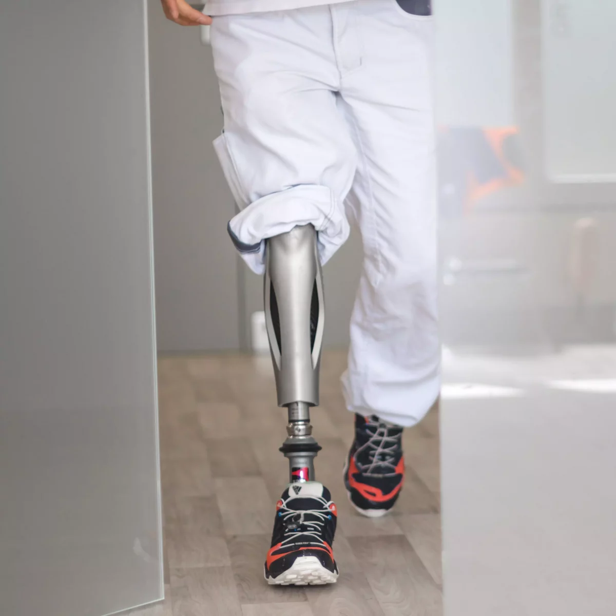 Prosthesis user wearing the Ottobock Genium Protector and walking