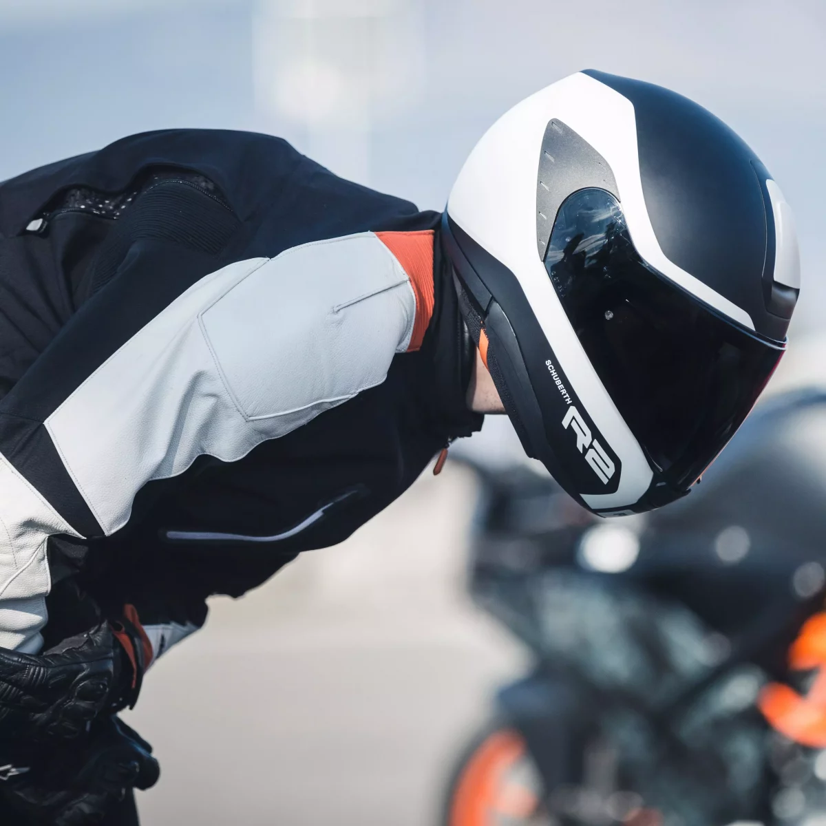 Motorcycle rider wearing Schuberth R2 helmet