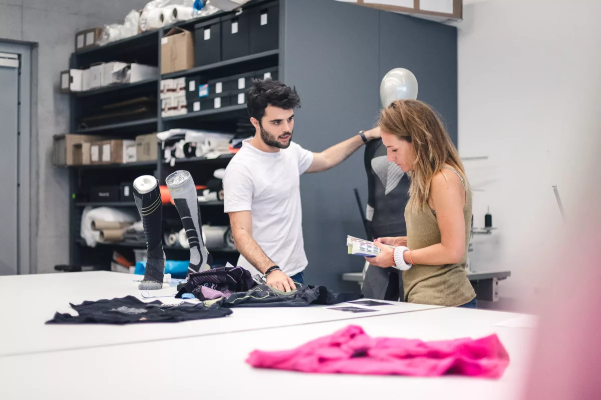 Apparel designers making a functional garment prototype